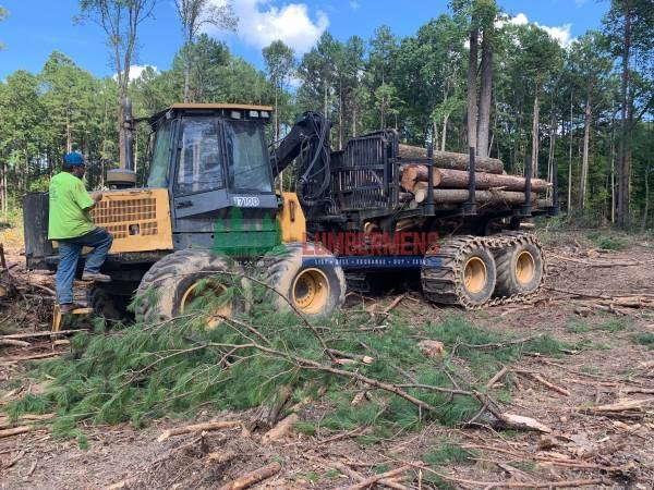 John Deere log forwarder in the woods