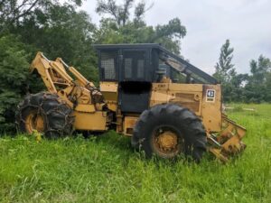 used grapple skidder in the field