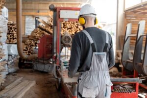 a worker working on sawmill for timber extraction
